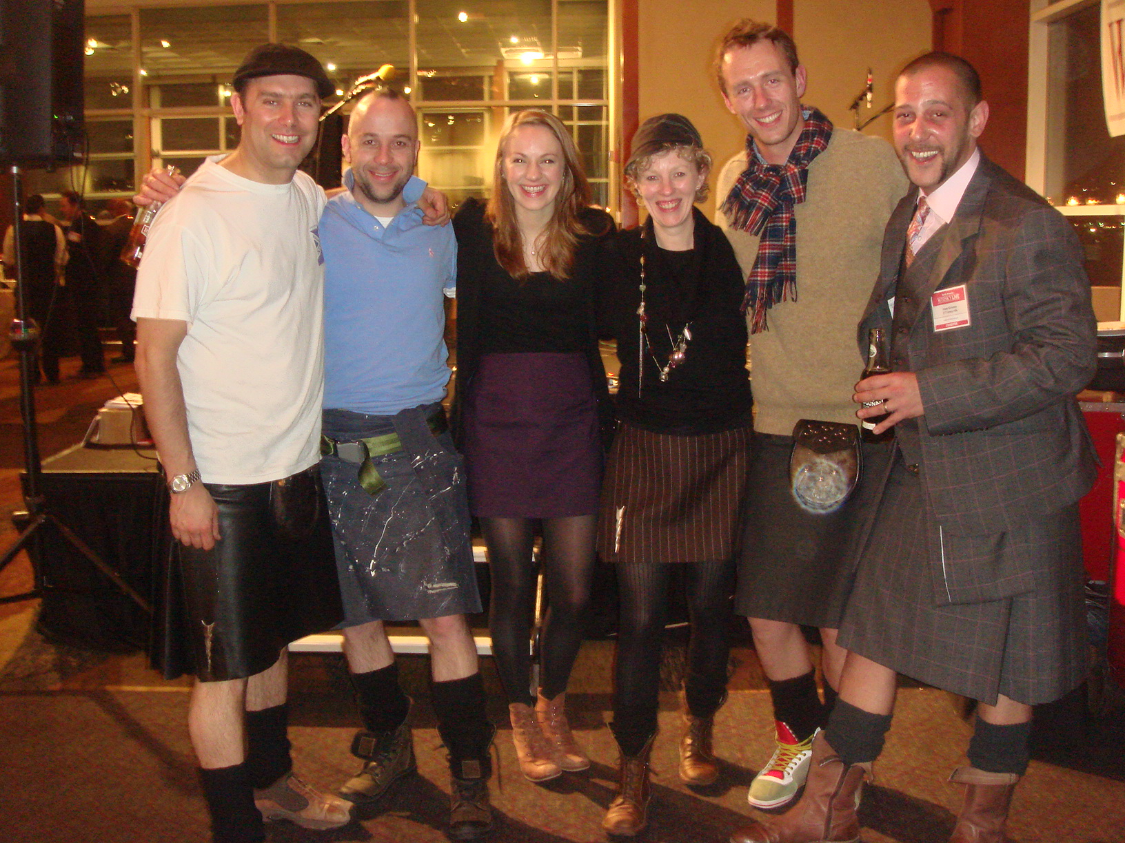 L–R: Iain MacPhail (bass), Scotty Arnott (drums), Jo McDowell (percussion), Siobhan Anderson (fiddle), Andy Elliot (sound-man), Howie Nicolsby (kilt supplier). Top image: Band, bboys and Assemble & Leap on the way to a gig.and L–R: Iain MacPhail (bass), Scotty Arnott (drums), Jo McDowell (percussion), Siobhan Anderson (fiddle), Andy Elliot (sound-man), Howie Nicolsby (kilt supplier). Top image: Band, bboys and Assemble & Leap on the way to a gig.and