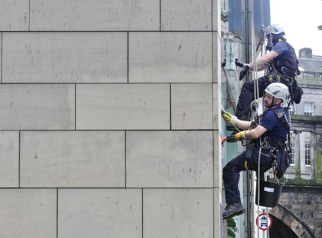 Zelensky lookalike window cleaner.